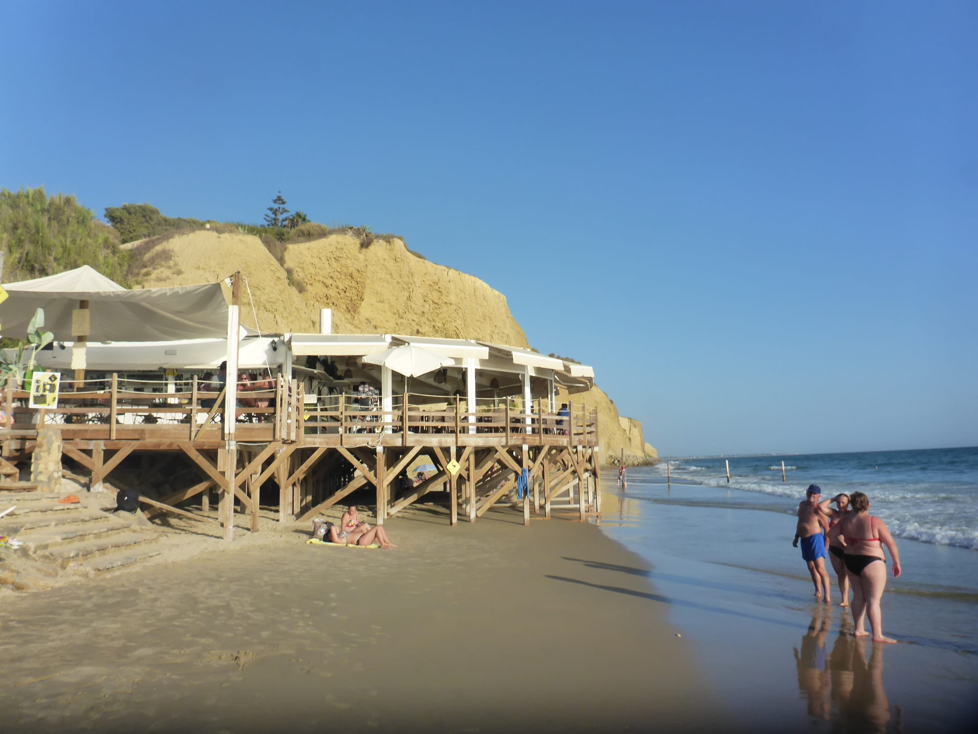 A wooden chiringuito beach bar on stilts above the sand, Andalusia